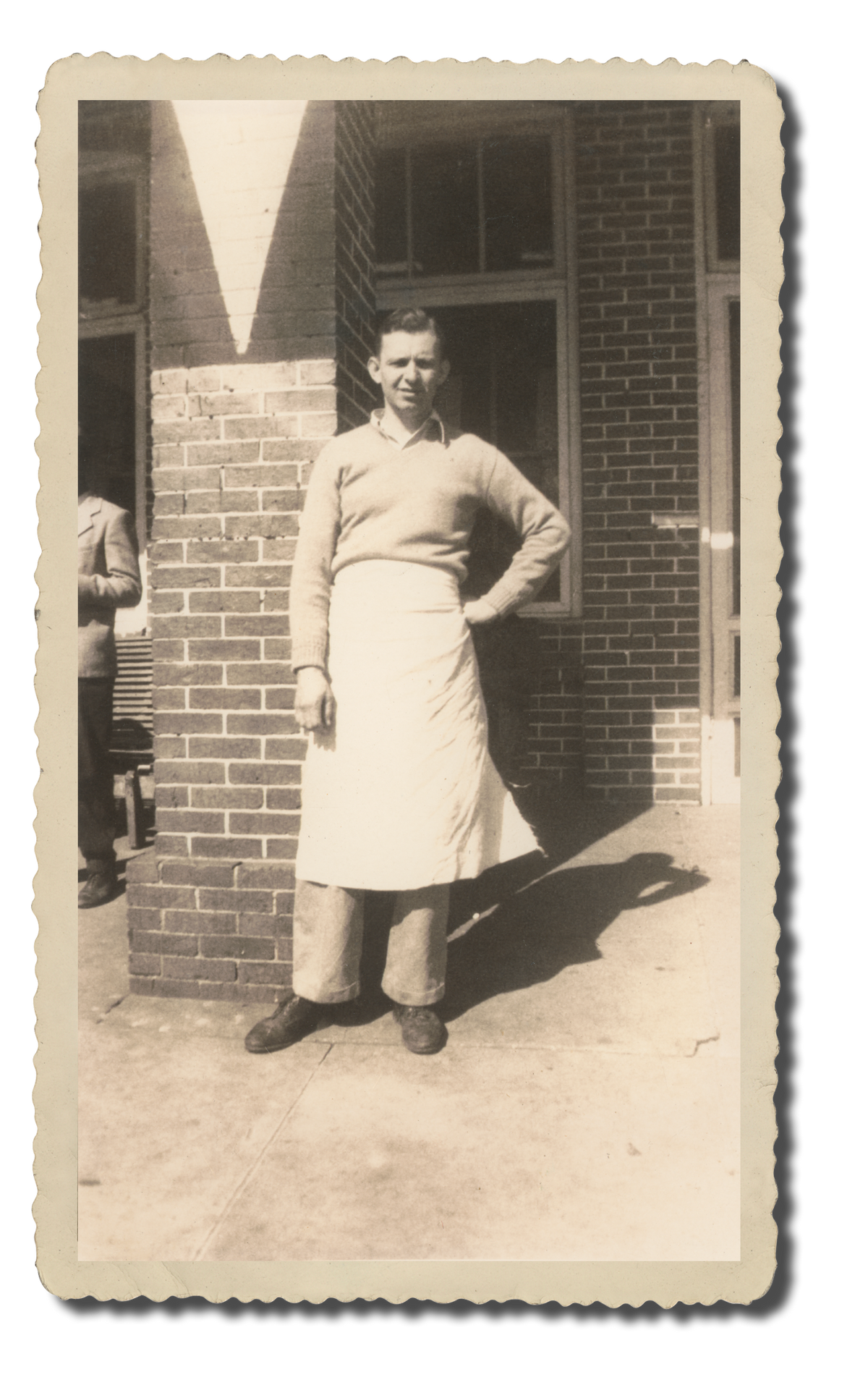 Vintage photo of Albert Parker in a baker's apron outside Claxton Bakery.